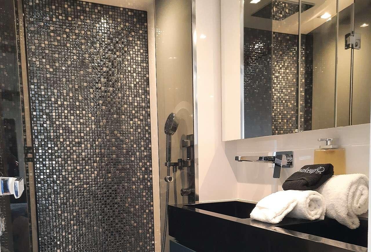 a bathroom with a large shower curtain aboard ORION Yacht for Charter