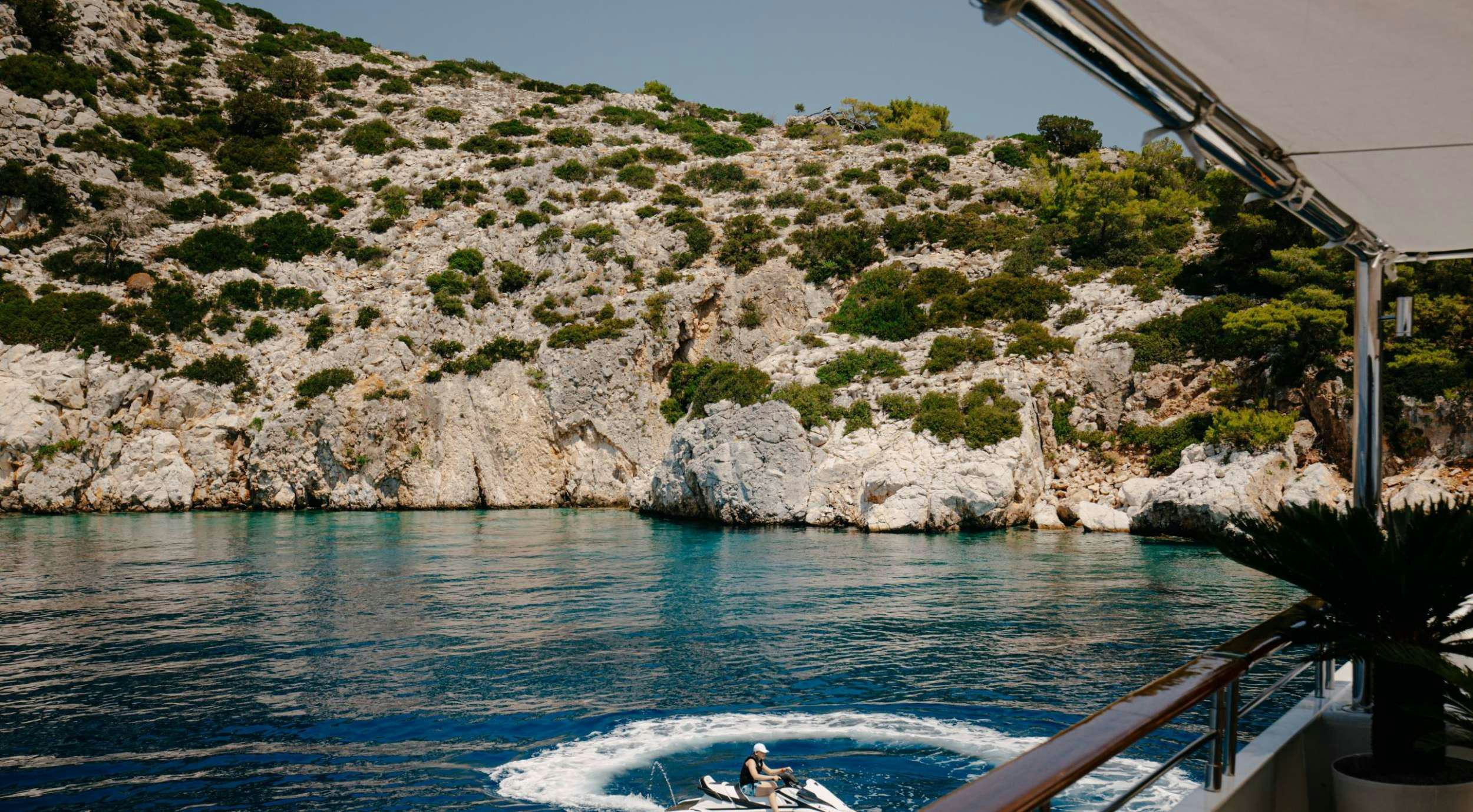a person on a boat in the water aboard ITOTO Yacht for Charter