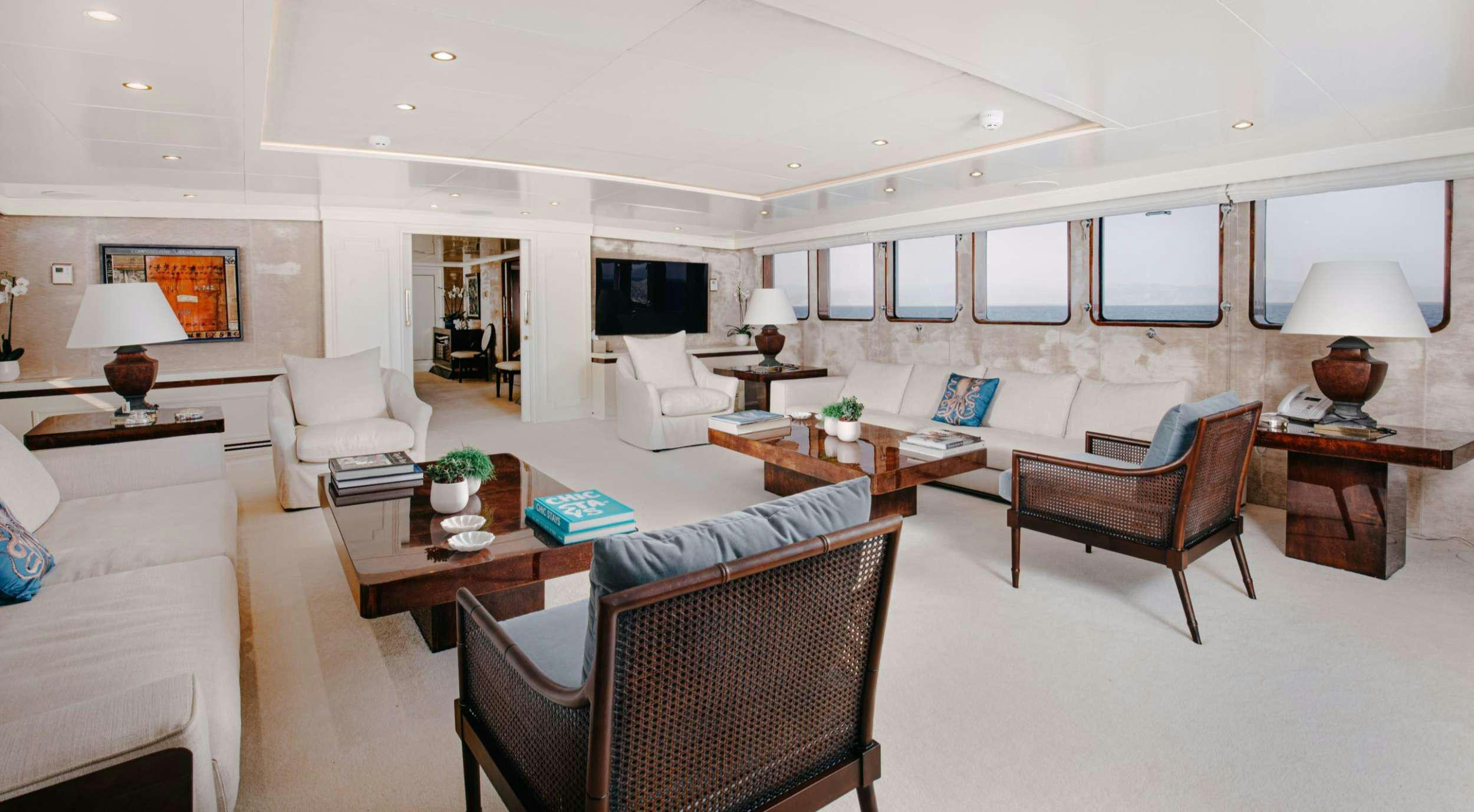 a living room with a couch and a table aboard ITOTO Yacht for Charter