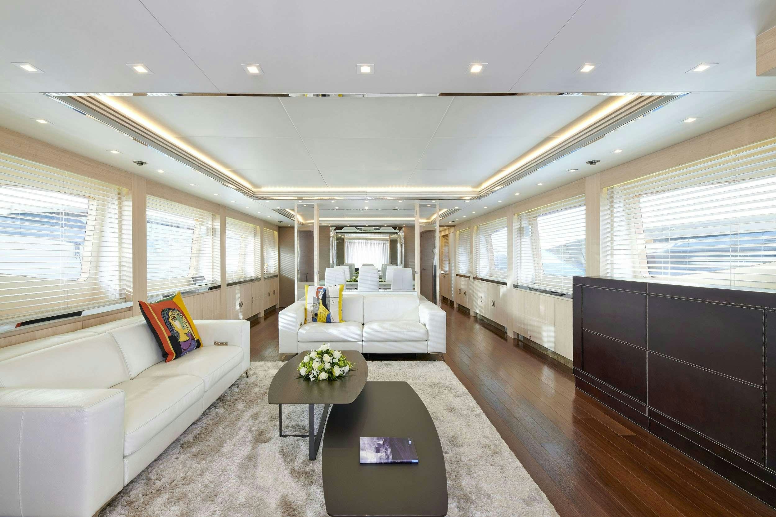 a living room with a couch and a coffee table aboard WHITE KNIGHT Yacht for Charter