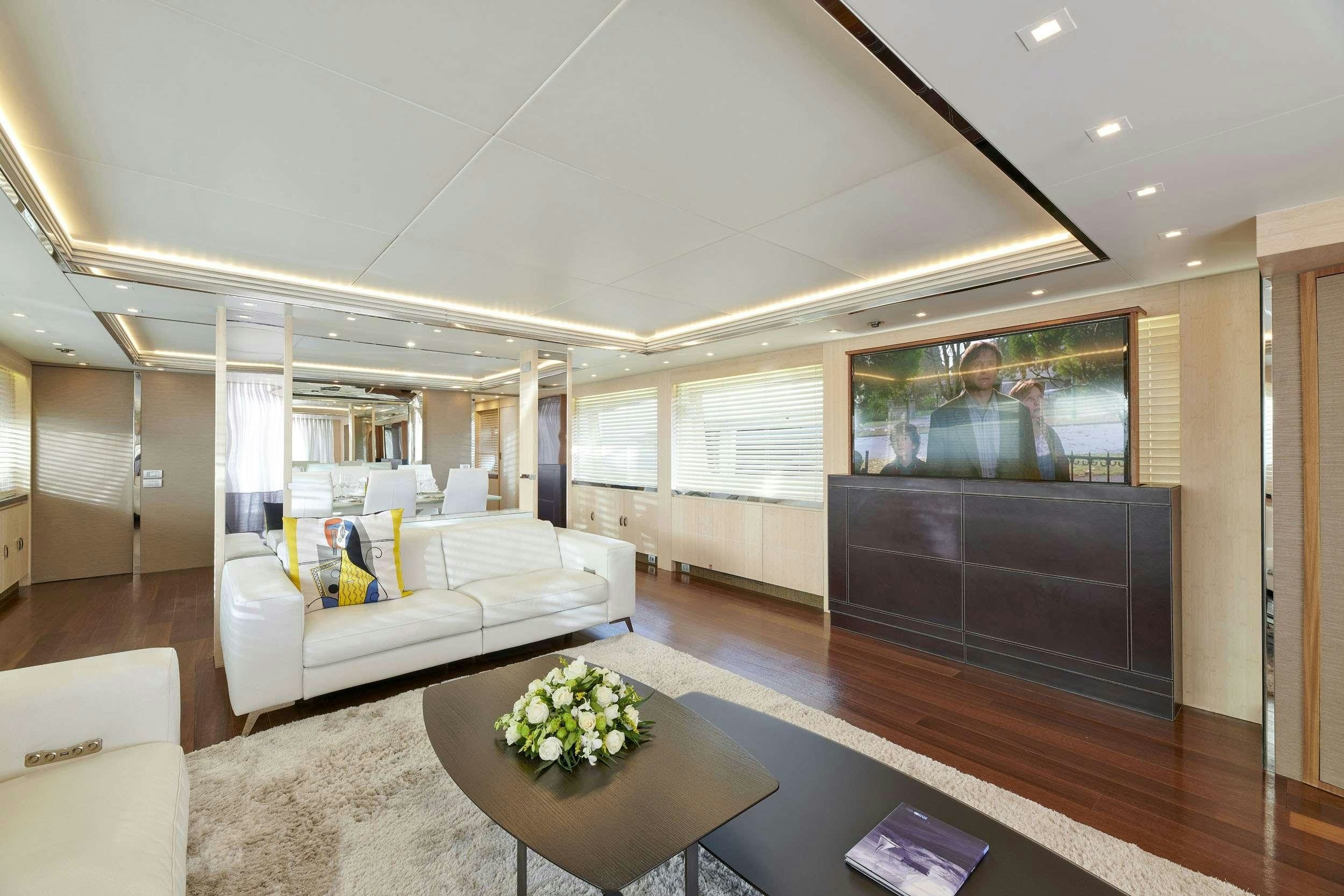 a living room with a large screen aboard WHITE KNIGHT Yacht for Charter