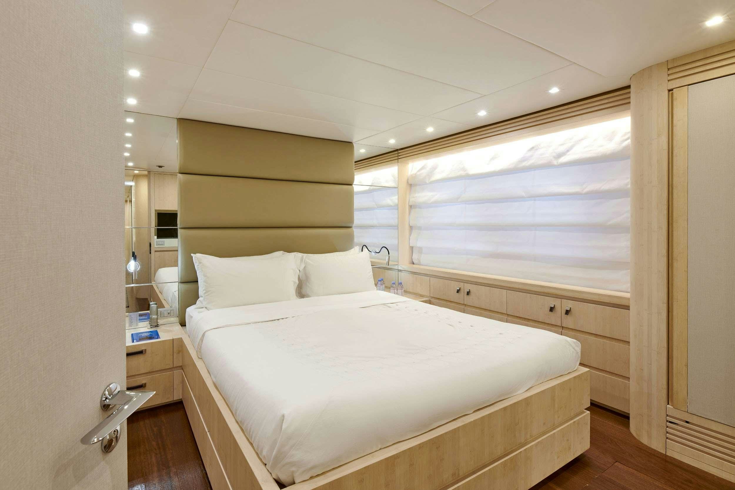 a bedroom with a large bed aboard WHITE KNIGHT Yacht for Charter