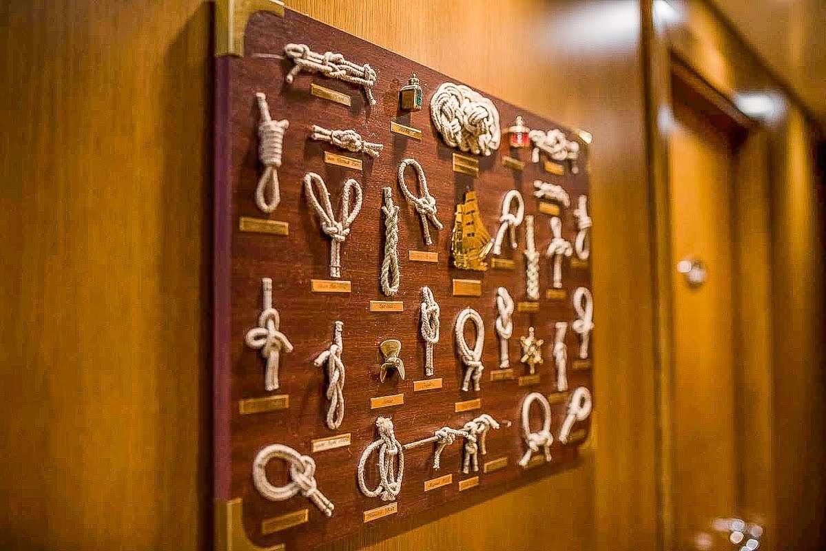 a wall with a number of keys aboard ARKTOS Yacht for Charter