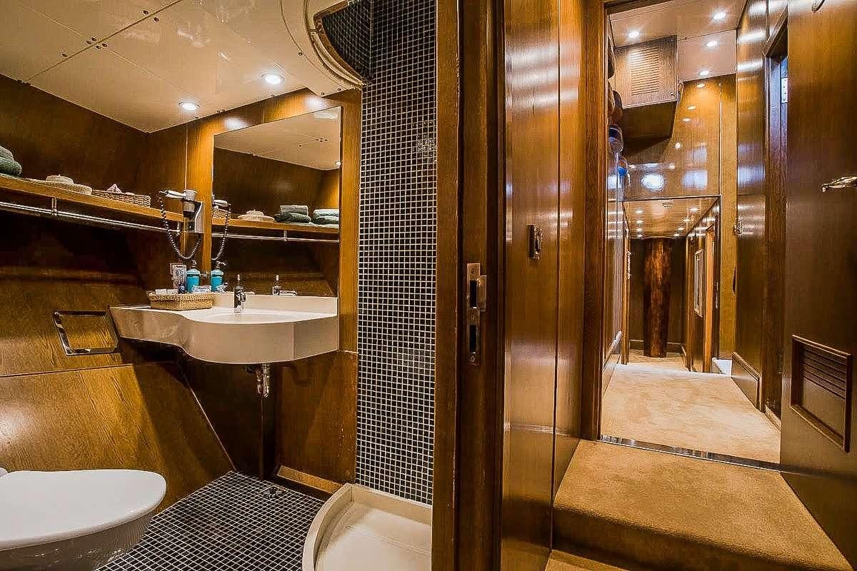 a bathroom with a sink and a shower aboard ARKTOS Yacht for Charter