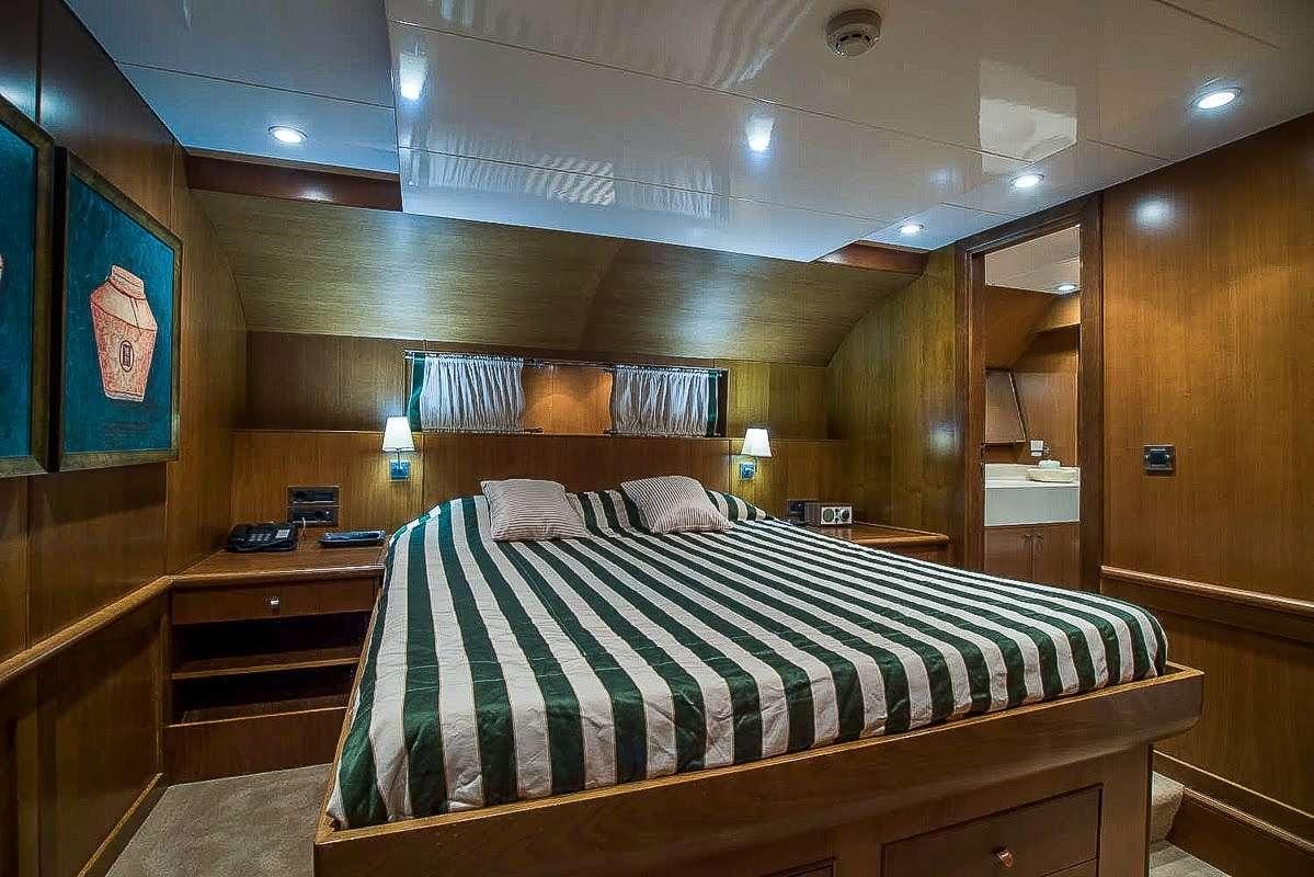 a bed in a room aboard ARKTOS Yacht for Charter