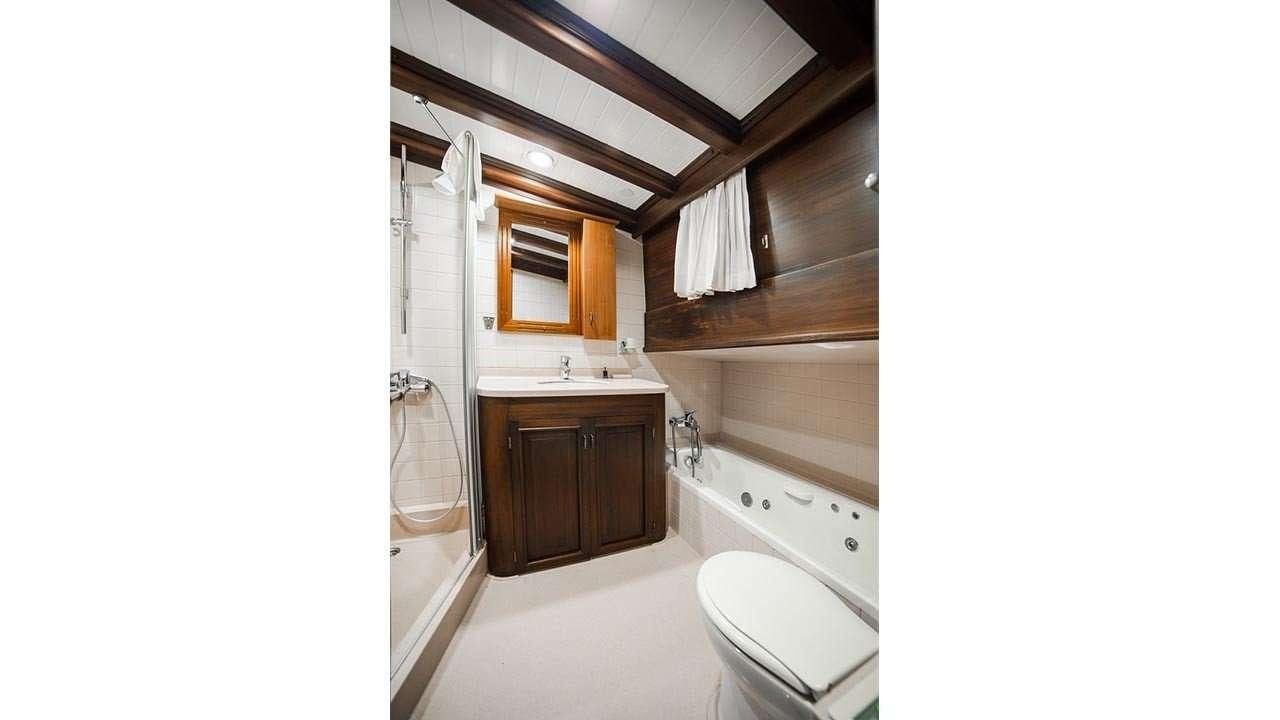 a bathroom with a sink and a toilet aboard WICKED FELINA Yacht for Charter