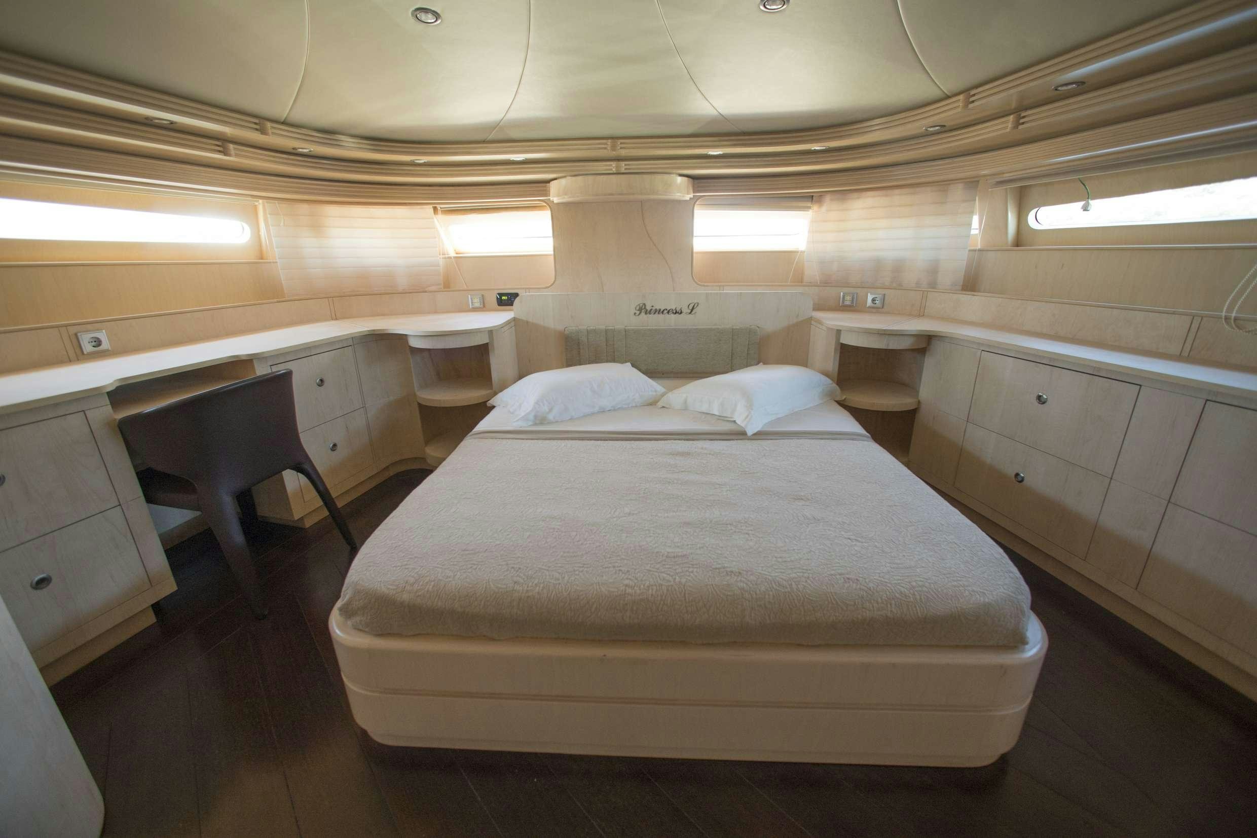 a bed in a room aboard PRINCESS L Yacht for Charter