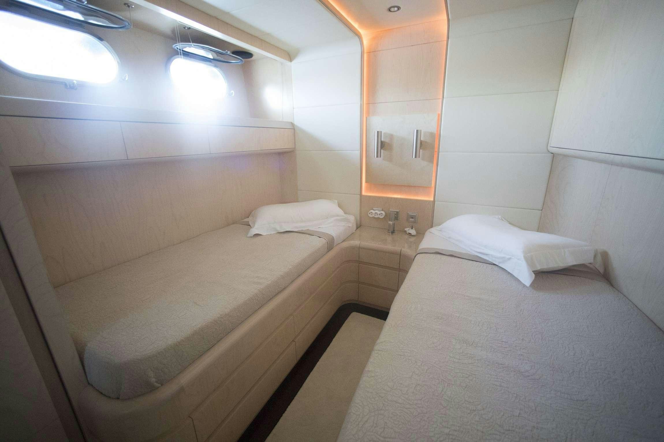 a room with two beds aboard PRINCESS L Yacht for Charter