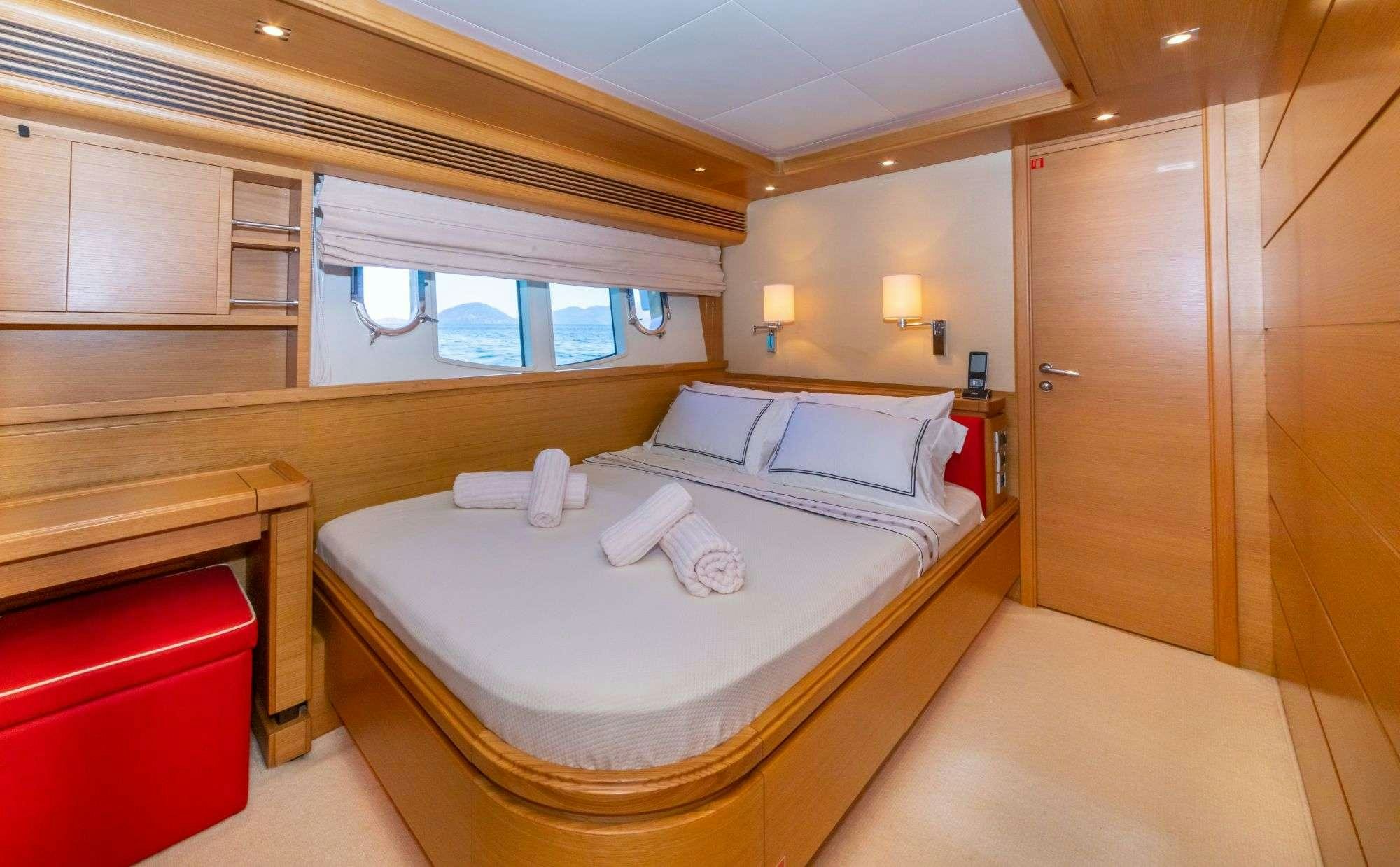 a room with a bed and a window aboard FUNDA D Yacht for Charter