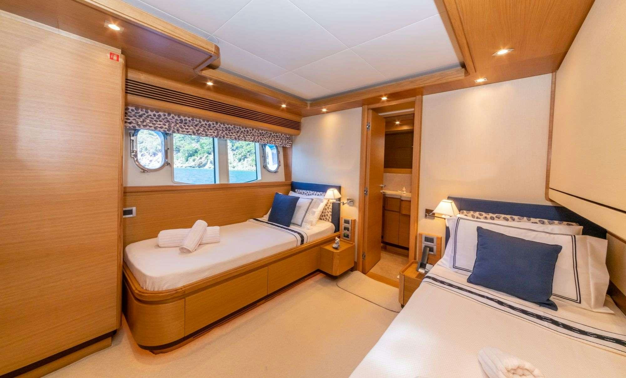 a room with two beds aboard FUNDA D Yacht for Charter