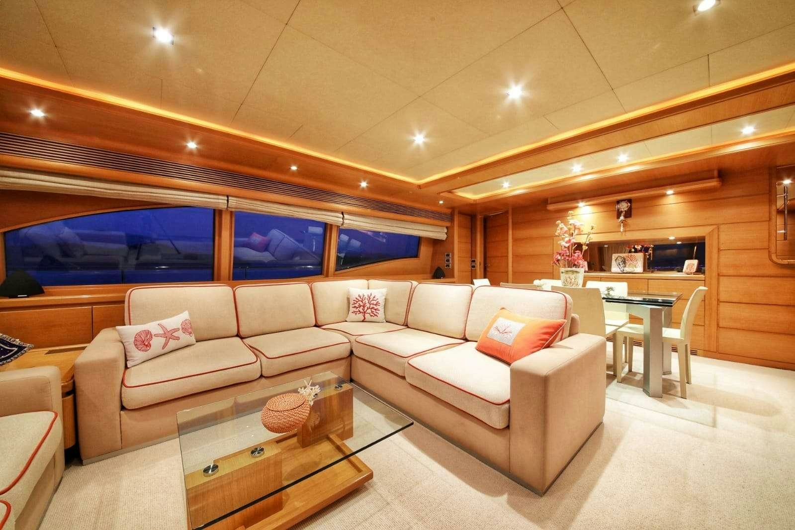 a living room with a couch and a table aboard FUNDA D Yacht for Charter