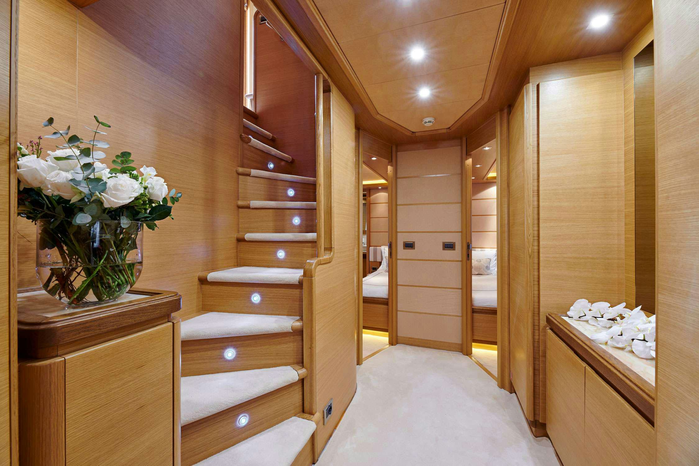 a wood cabinet in a room aboard SEVEN S Yacht for Charter