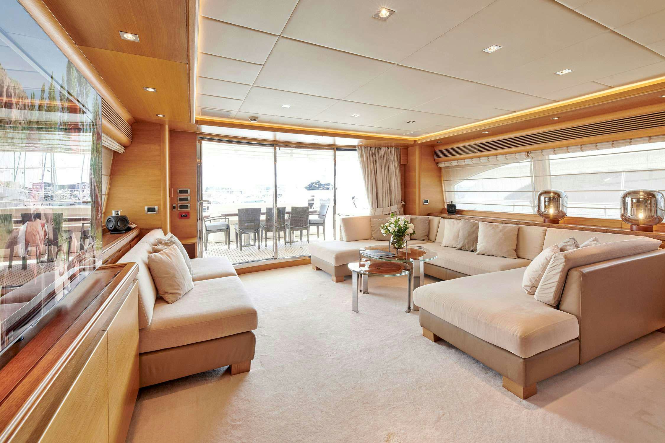 a living room with a large window aboard SEVEN S Yacht for Charter