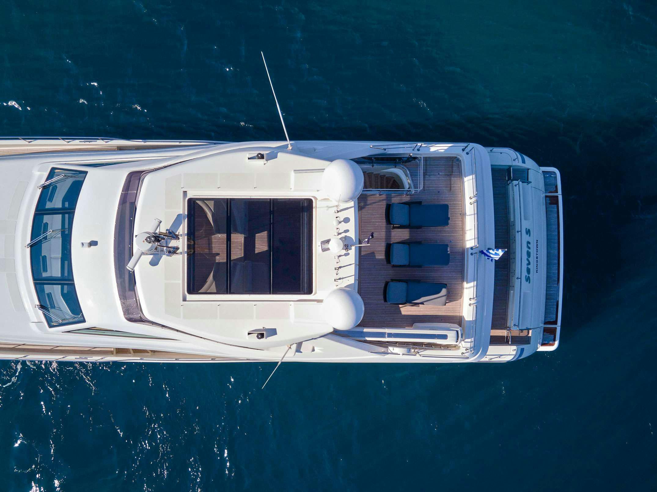 a white boat with blue water aboard SEVEN S Yacht for Charter