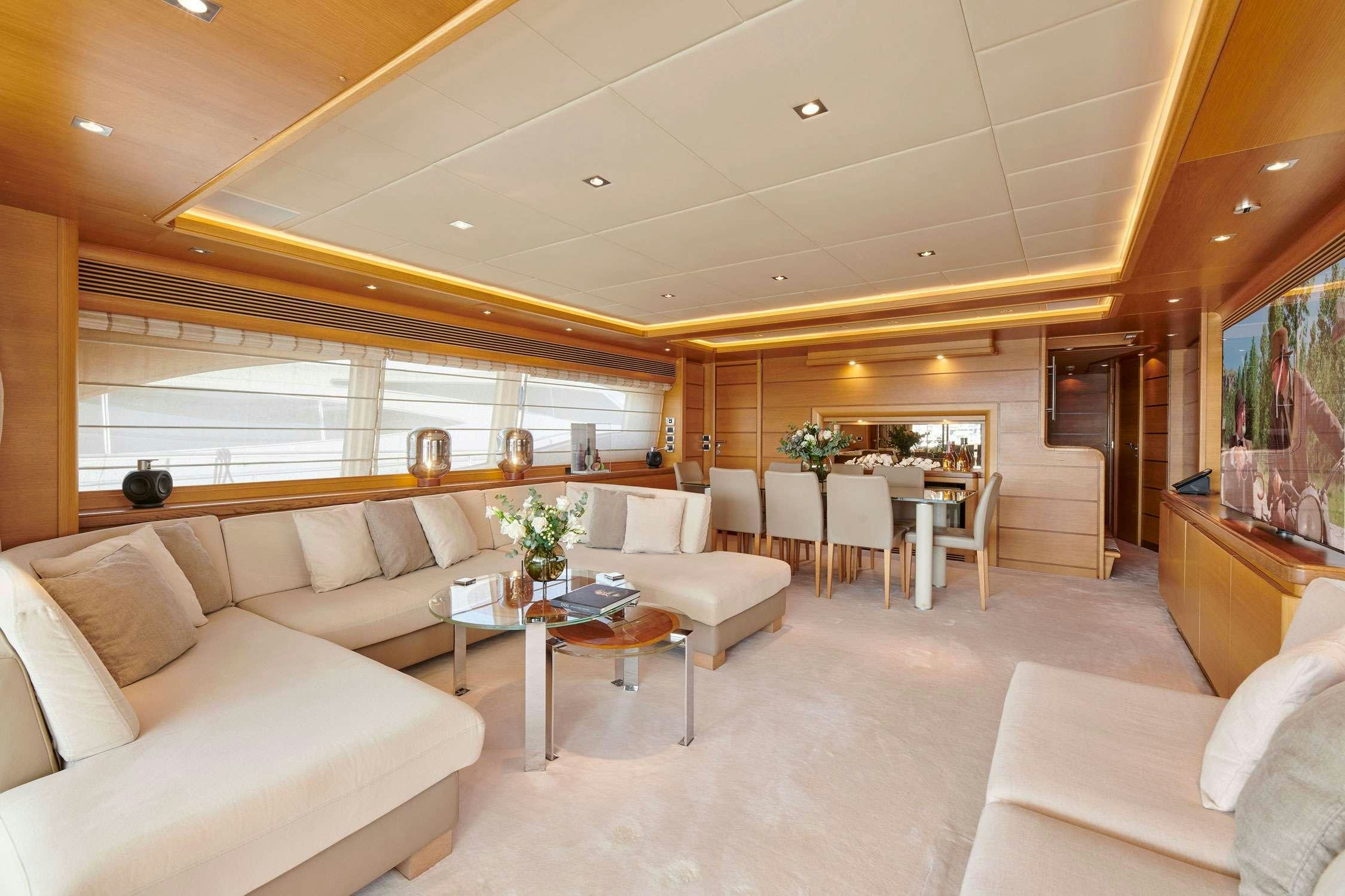 a living room with a large window aboard SEVEN S Yacht for Charter