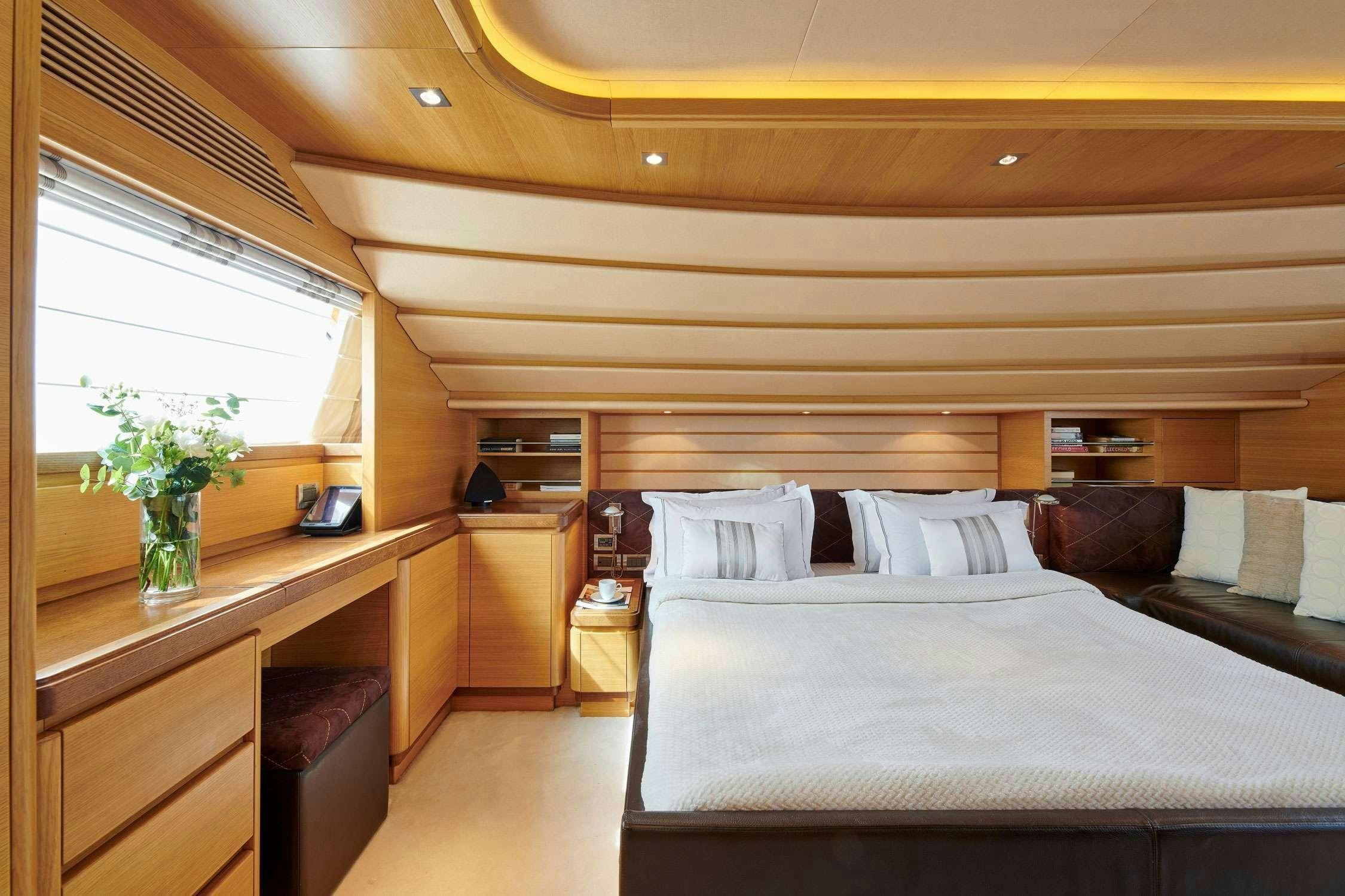 a bed in a room aboard SEVEN S Yacht for Charter