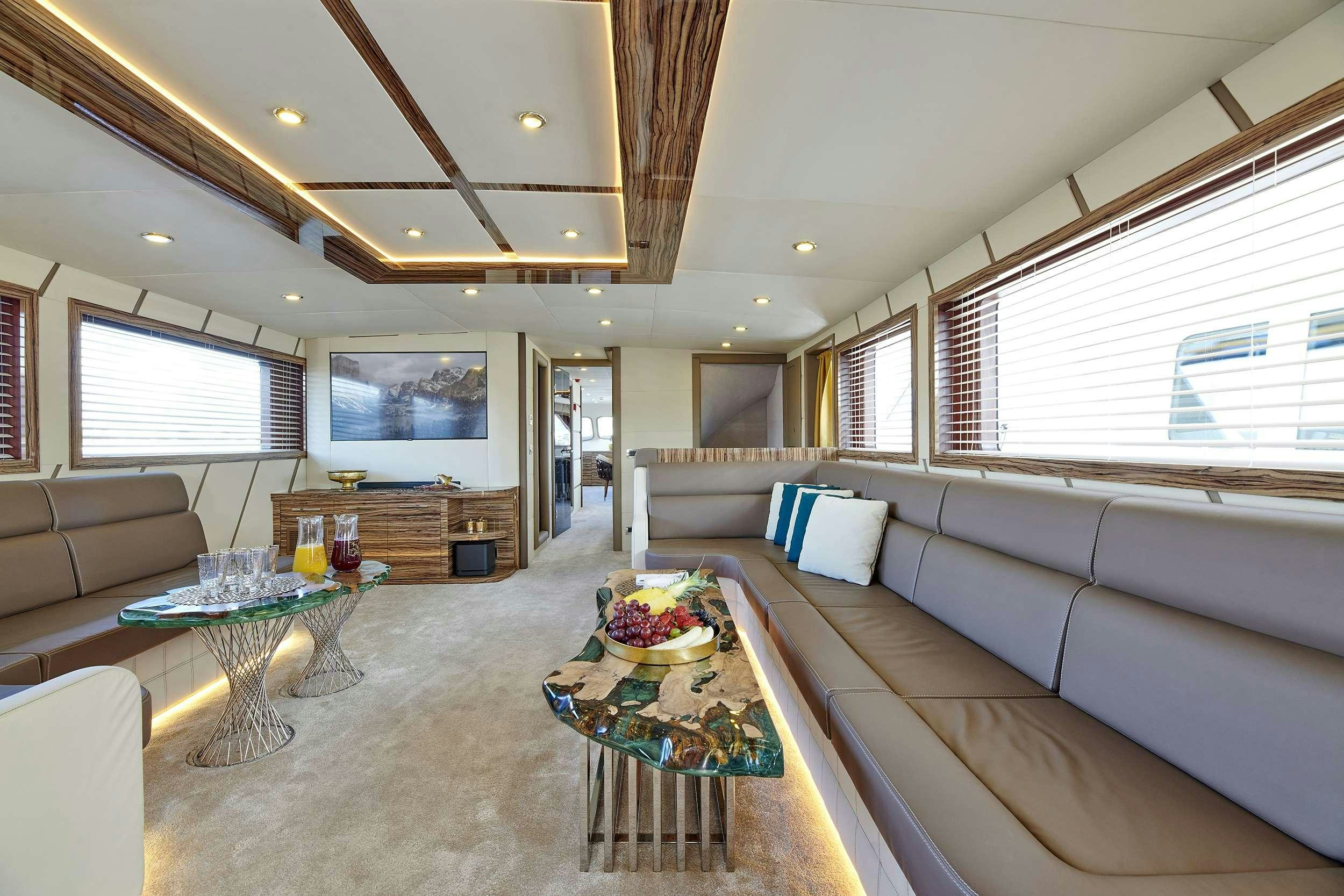 a living room with a couch and a table aboard WIDE LIBERTY Yacht for Charter