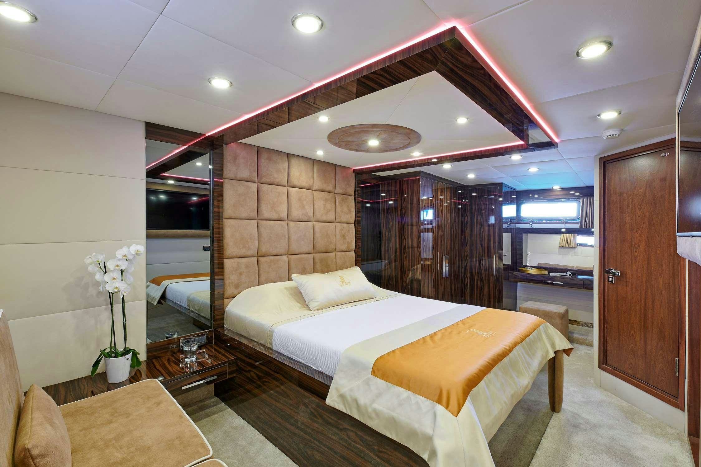 a hotel room with a bed aboard WIDE LIBERTY Yacht for Charter