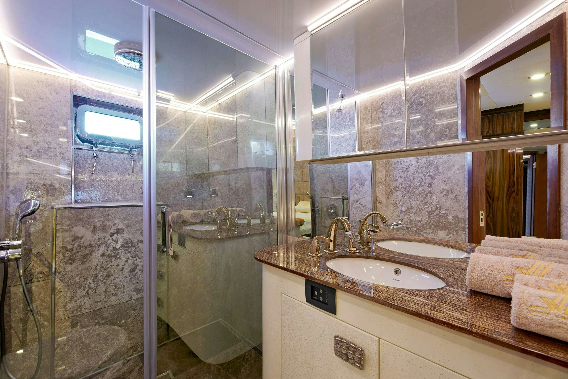 a bathroom with a glass shower aboard WIDE LIBERTY Yacht for Charter