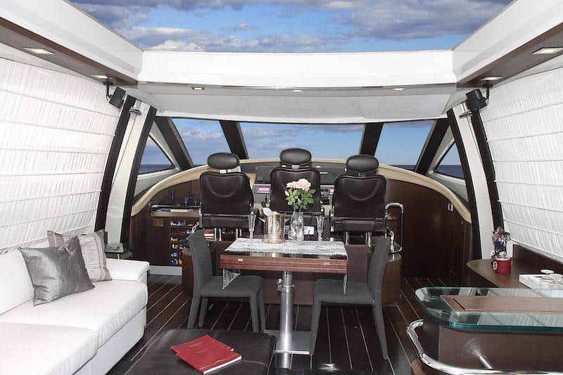 inside of a tent with a table and chairs aboard SUPER TOY Yacht for Charter
