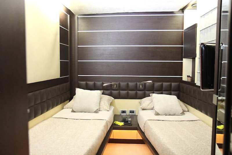 a room with two beds aboard SUPER TOY Yacht for Charter