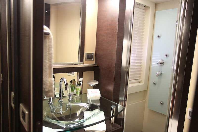 a bathroom with a sink and a mirror aboard SUPER TOY Yacht for Charter
