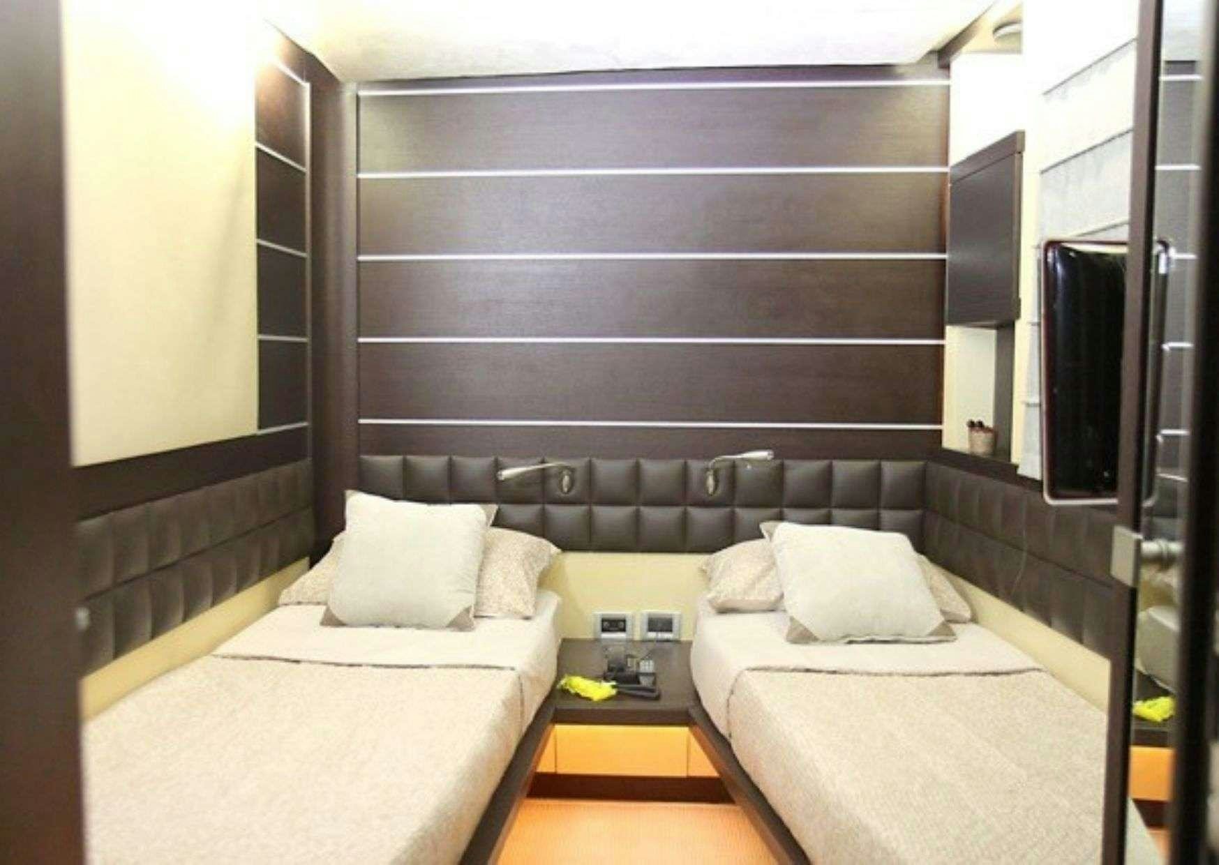 a bed in a room aboard SUPER TOY Yacht for Charter