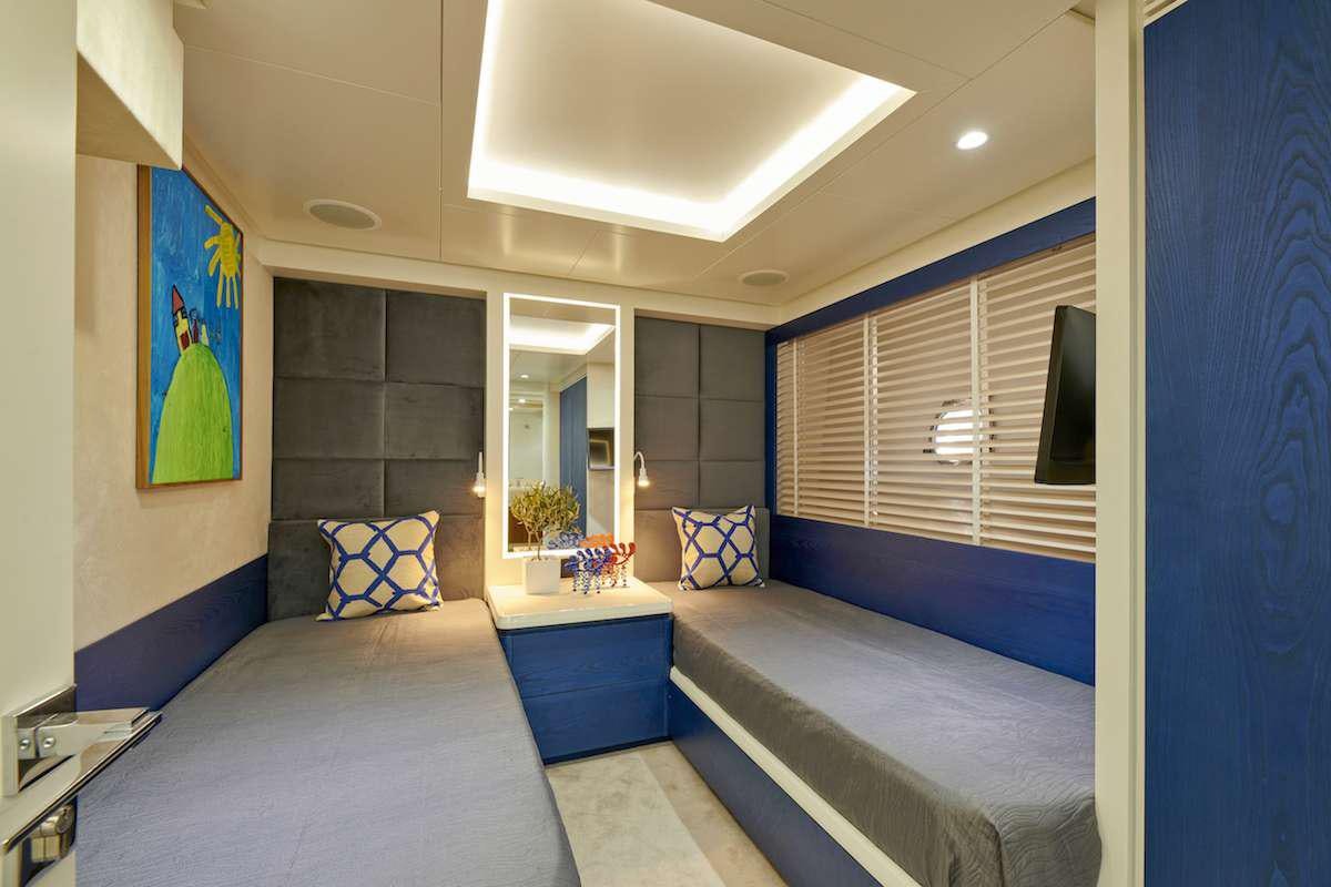 a room with a bed and a window aboard LA FENICE Yacht for Charter