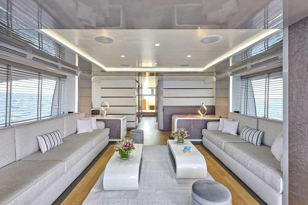 a living room with a large window aboard LA FENICE Yacht for Charter