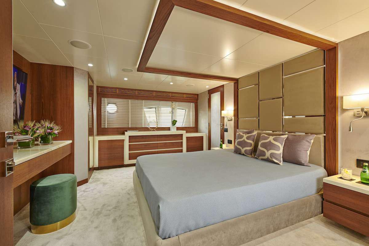 a bed in a room aboard LA FENICE Yacht for Charter