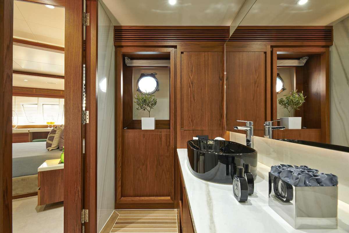 a bathroom with a large mirror aboard LA FENICE Yacht for Charter
