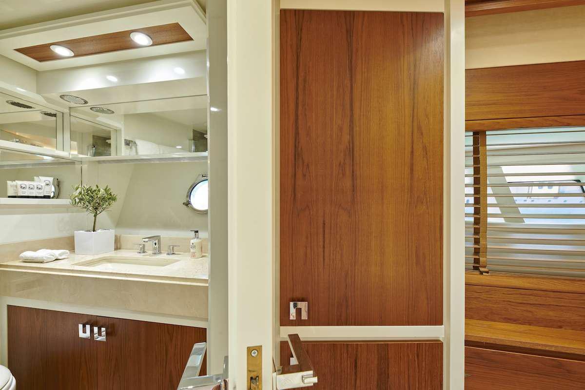 a bathroom with a sink and a mirror aboard LA FENICE Yacht for Charter