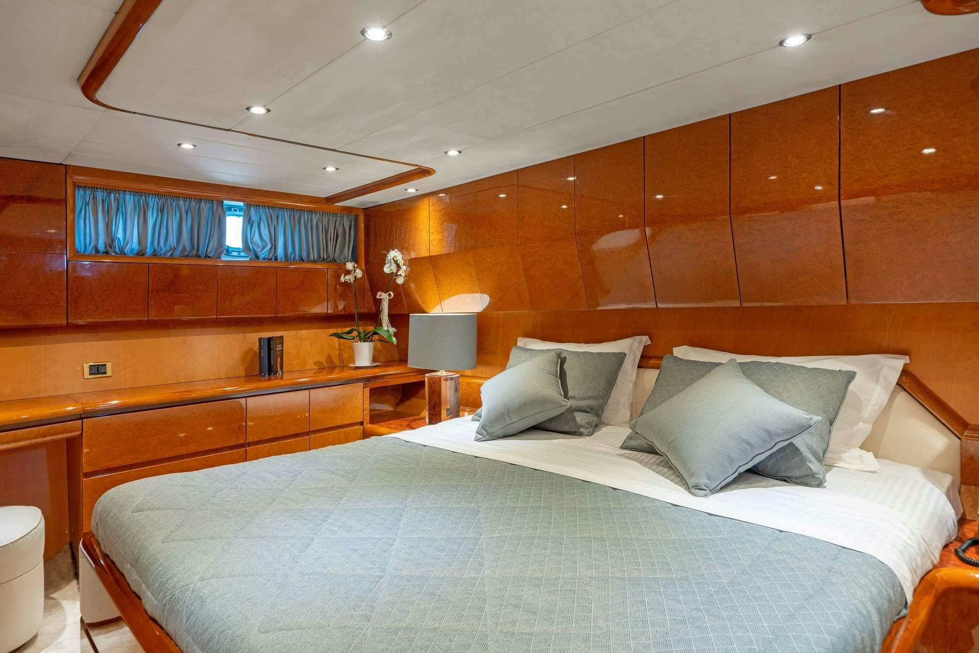 a bed in a room aboard ALANDINI Yacht for Charter