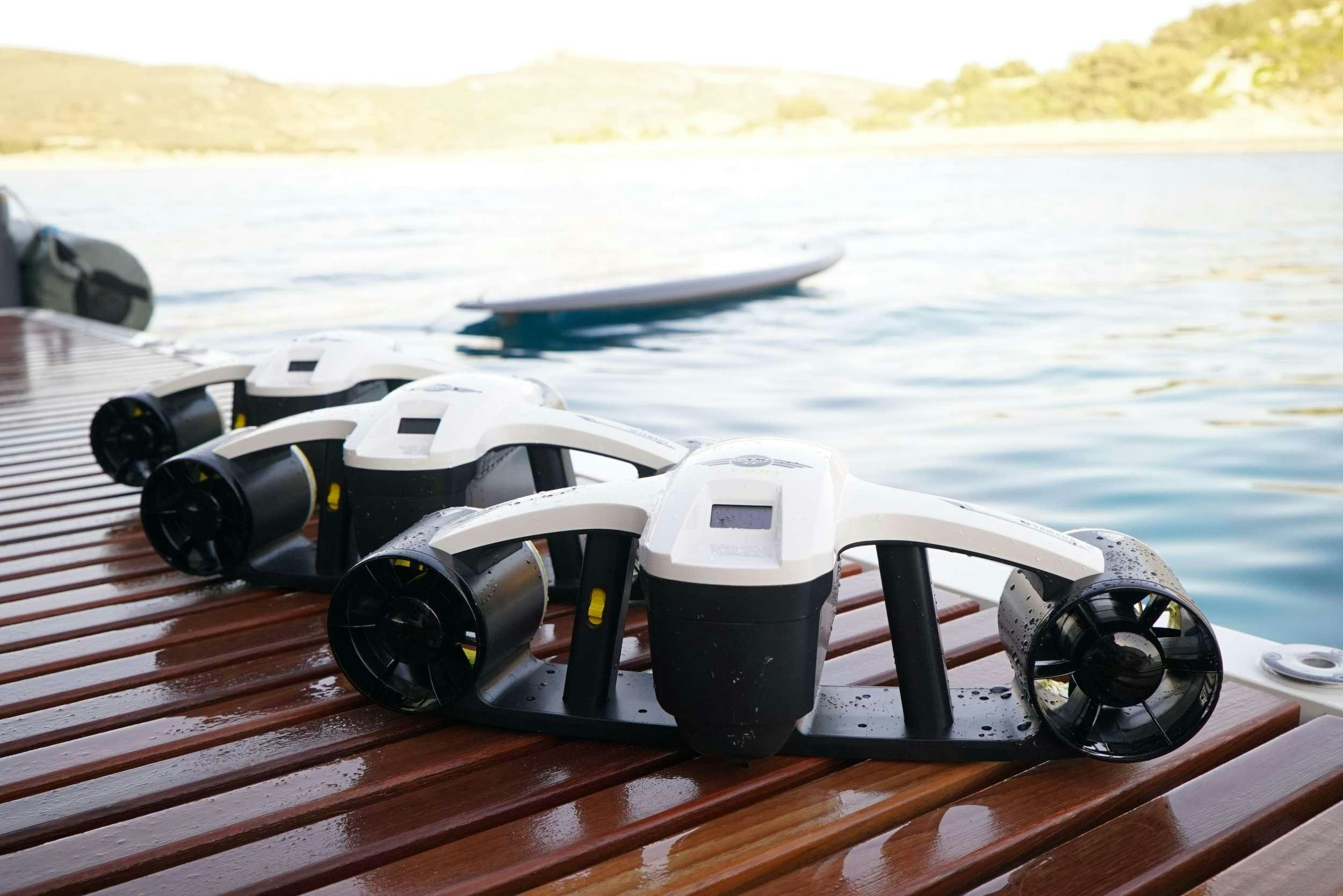 a toy helicopter on a deck aboard GENNY Yacht for Charter