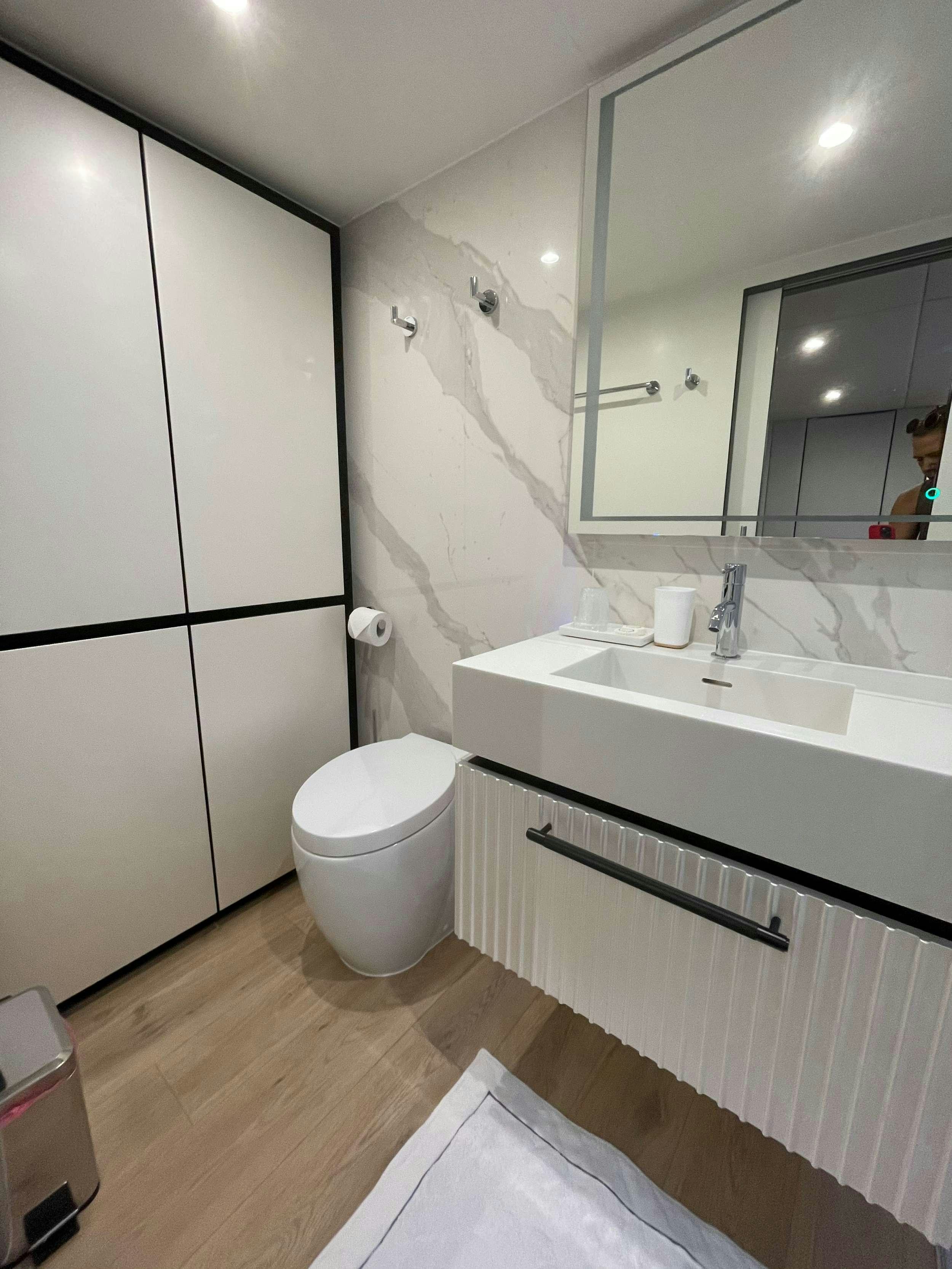 a bathroom with a sink and a toilet aboard GENNY Yacht for Charter