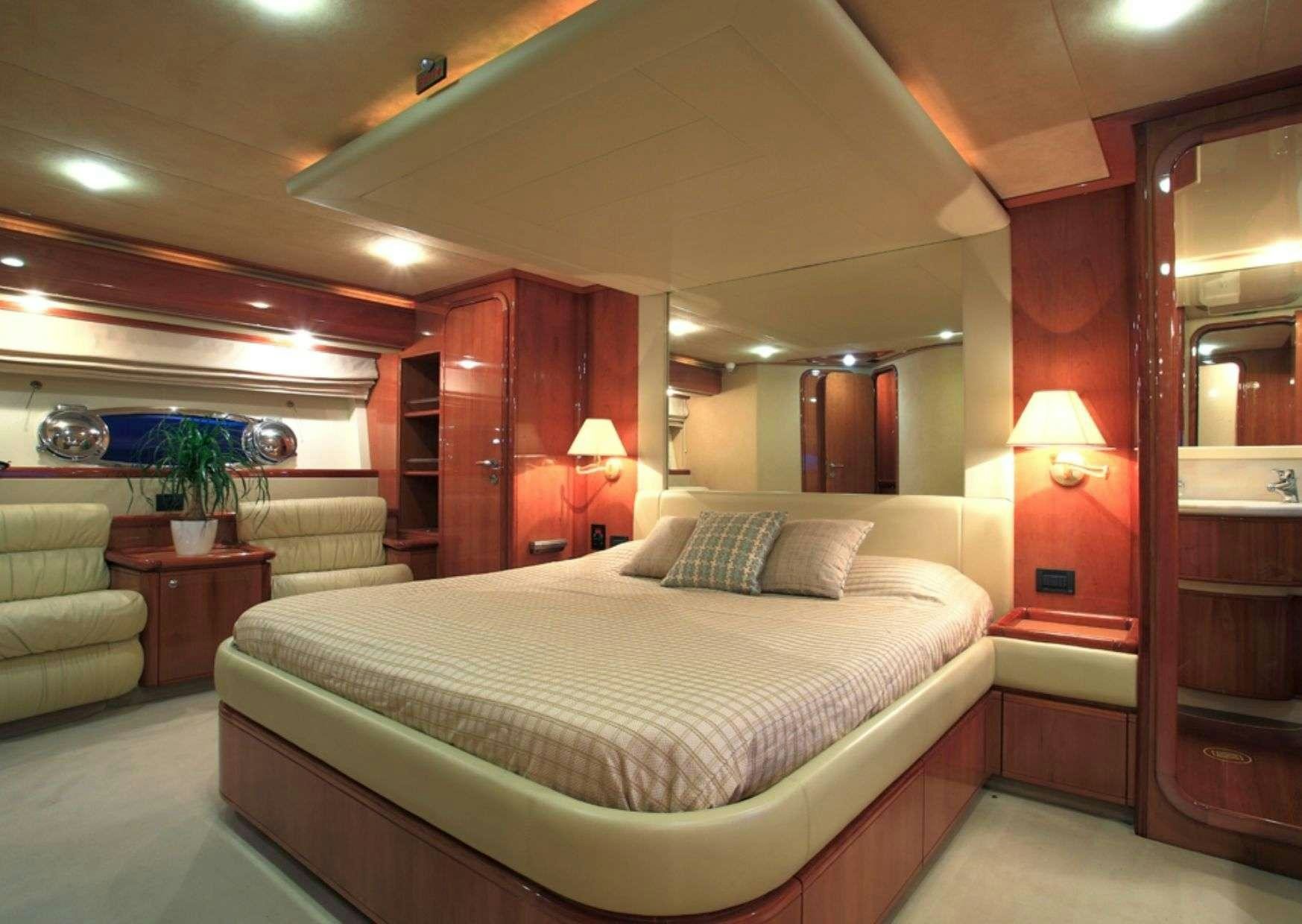 a bed in a room aboard ADE YIA Yacht for Charter