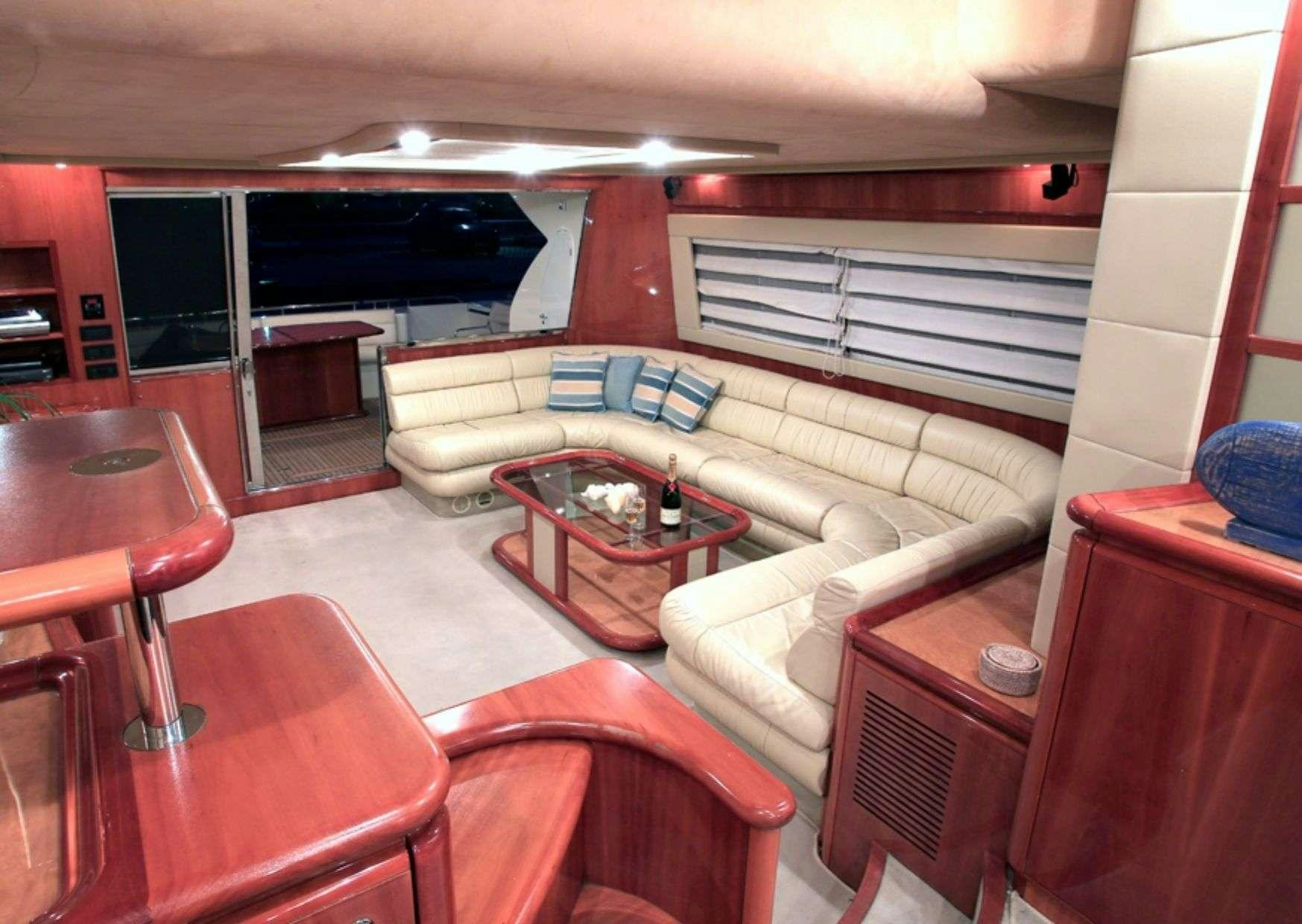 a living room with a couch and a table aboard ADE YIA Yacht for Charter