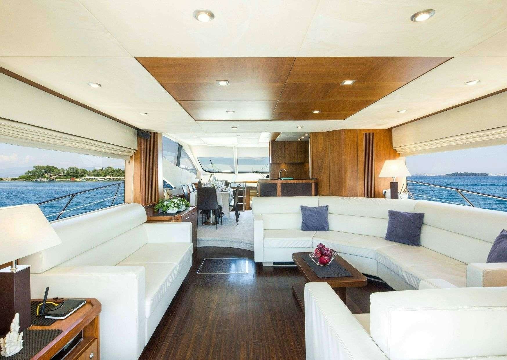 a living room with a large window aboard SHINE Yacht for Charter