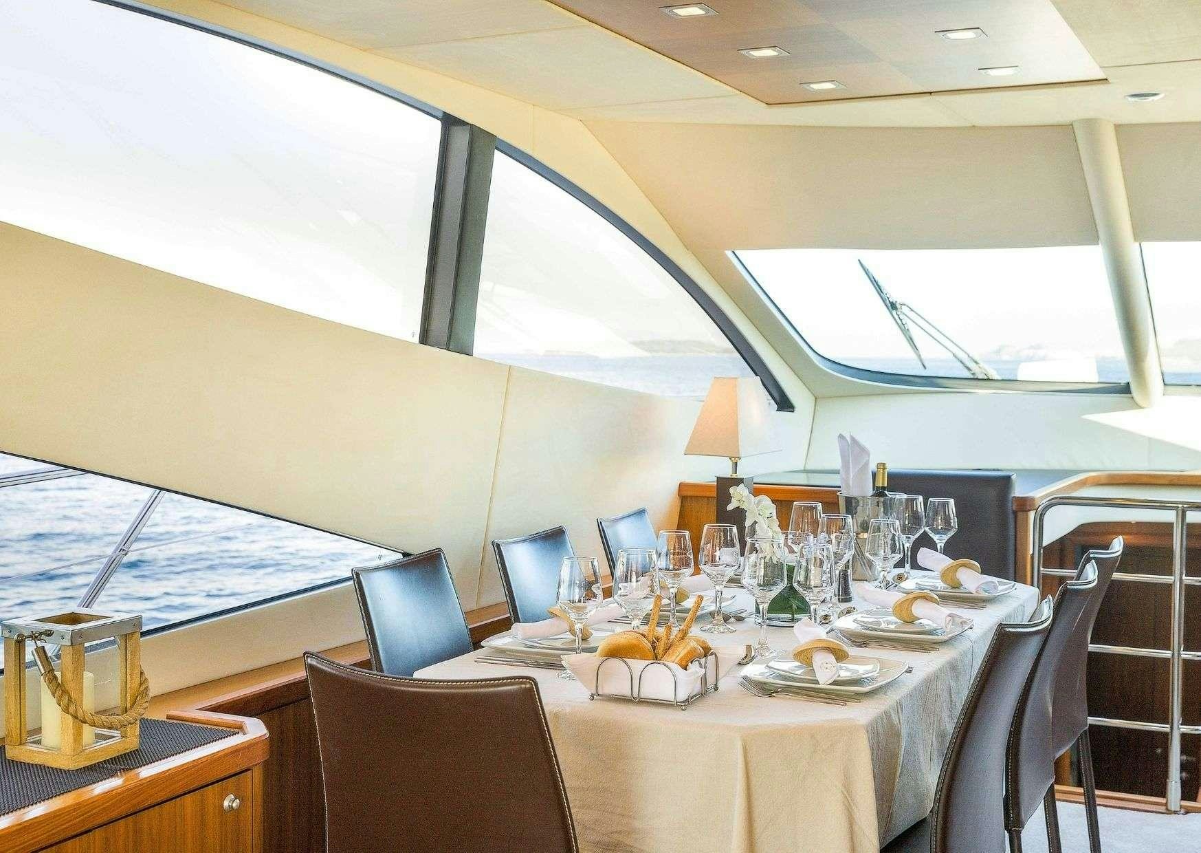 a table set for a meal aboard SHINE Yacht for Charter