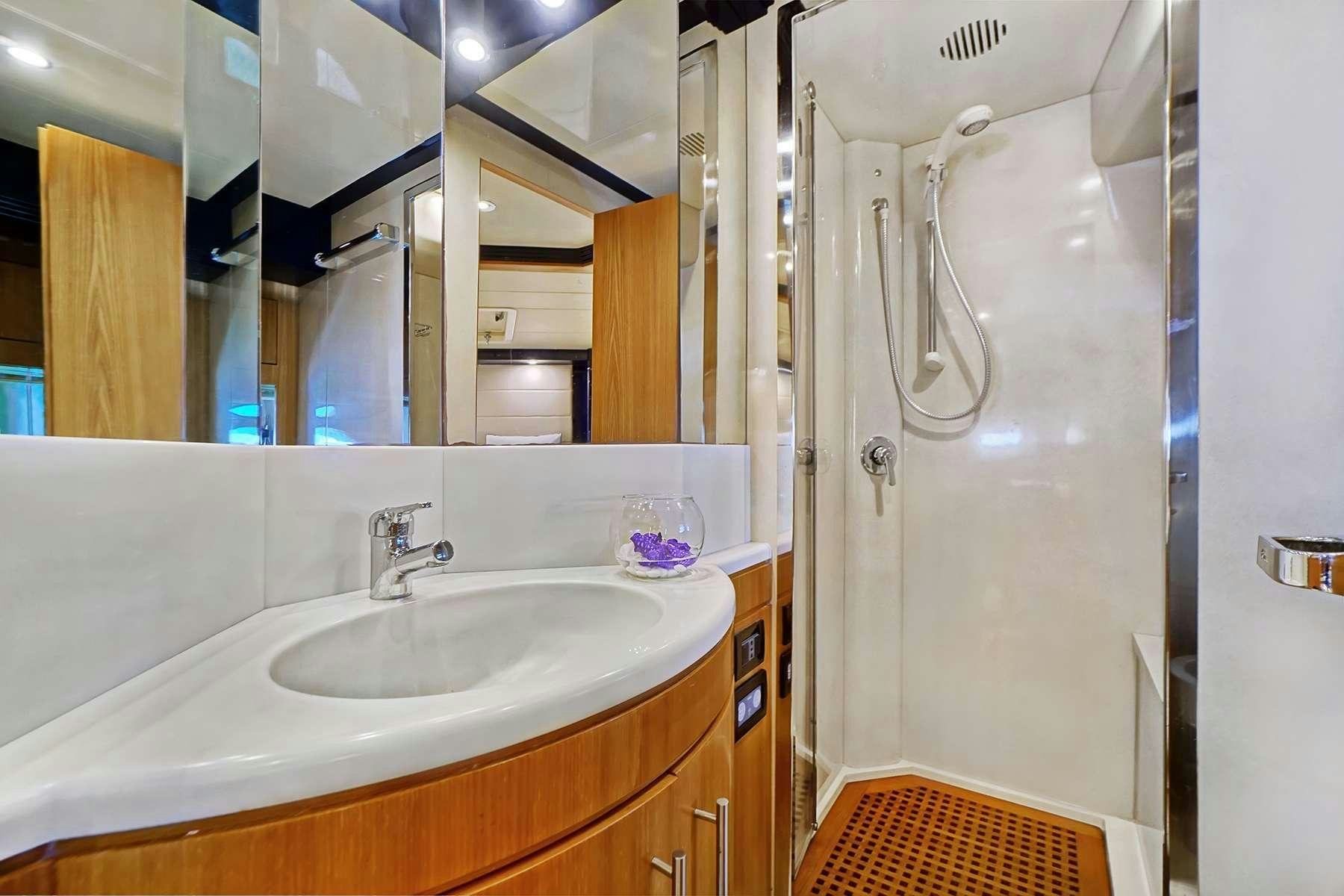 a bathroom with a shower and sink aboard SEA U Yacht for Charter