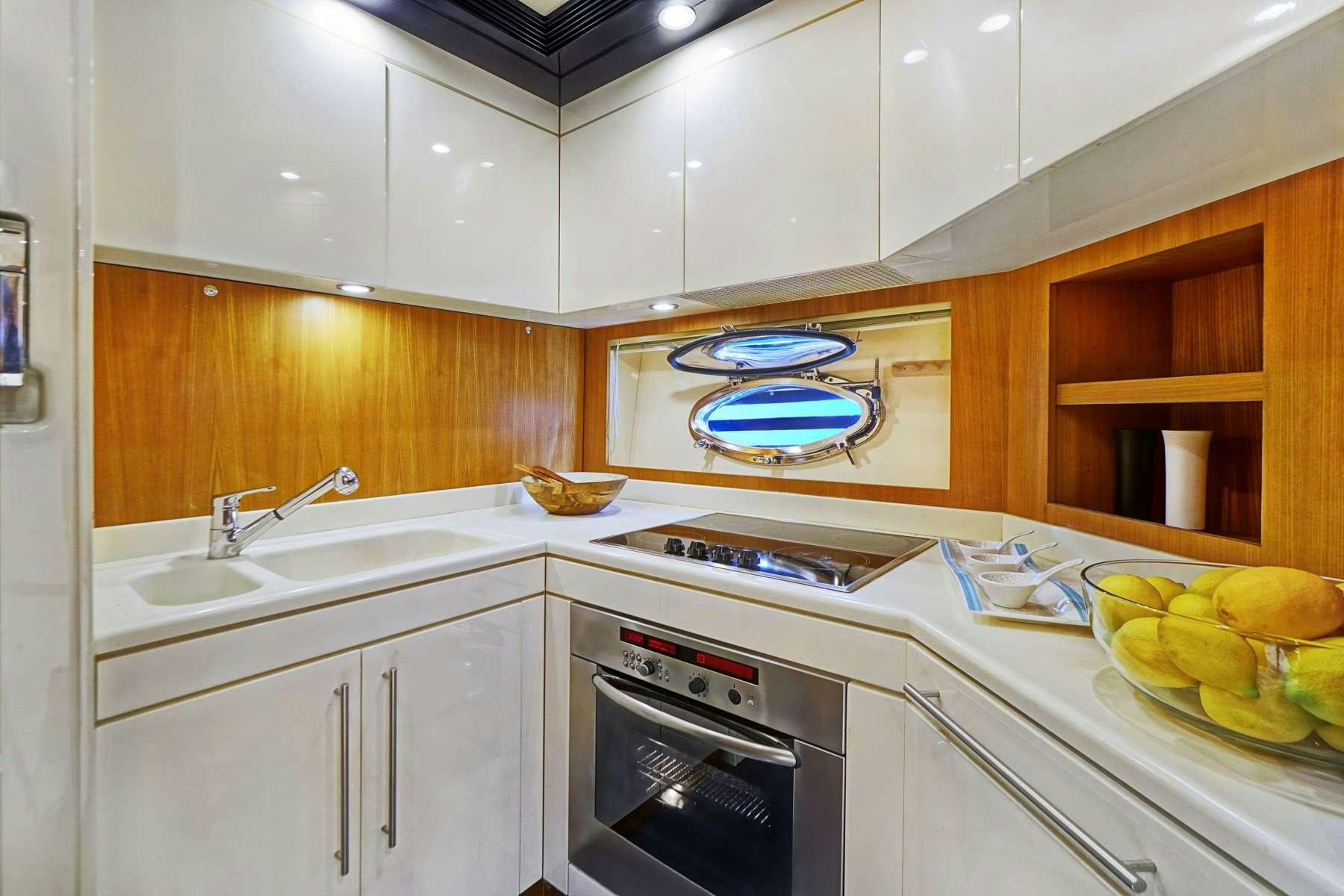 a kitchen with a sink and cabinets aboard SEA U Yacht for Charter