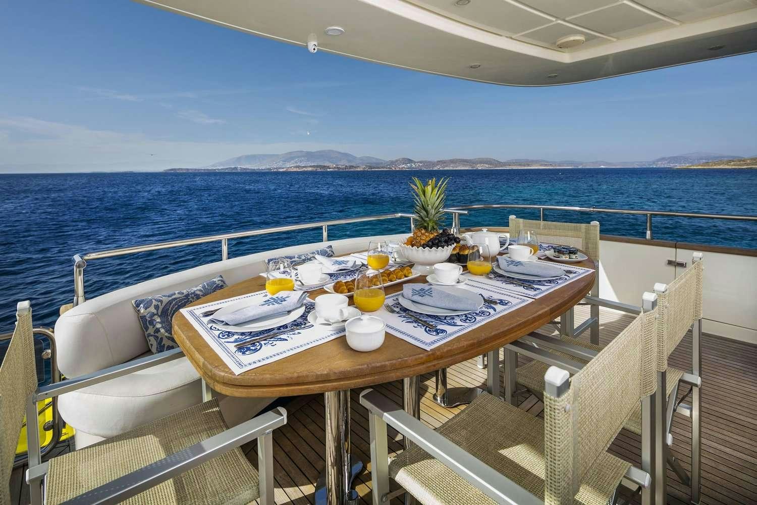 a table with food on it aboard GORGEOUS Yacht for Charter
