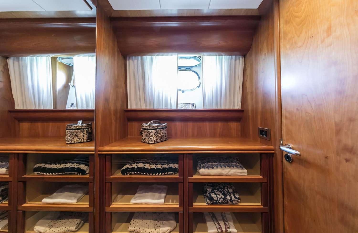 a wooden cabinet with drawers aboard GORGEOUS Yacht for Charter