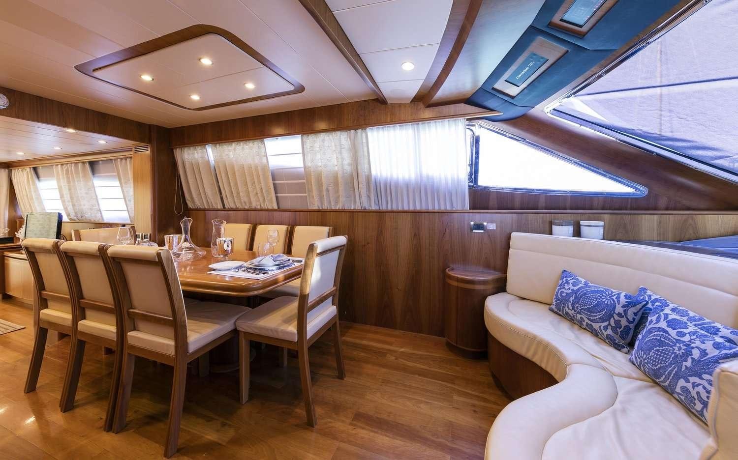 a living room with a couch and a table aboard GORGEOUS Yacht for Charter
