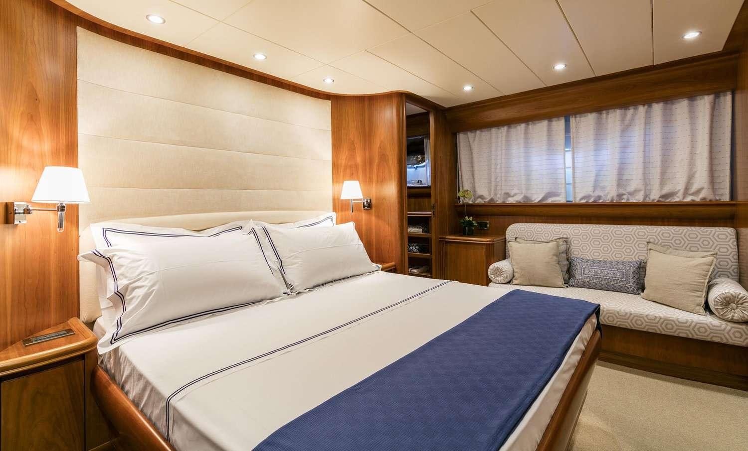 a hotel room with a bed aboard GORGEOUS Yacht for Charter