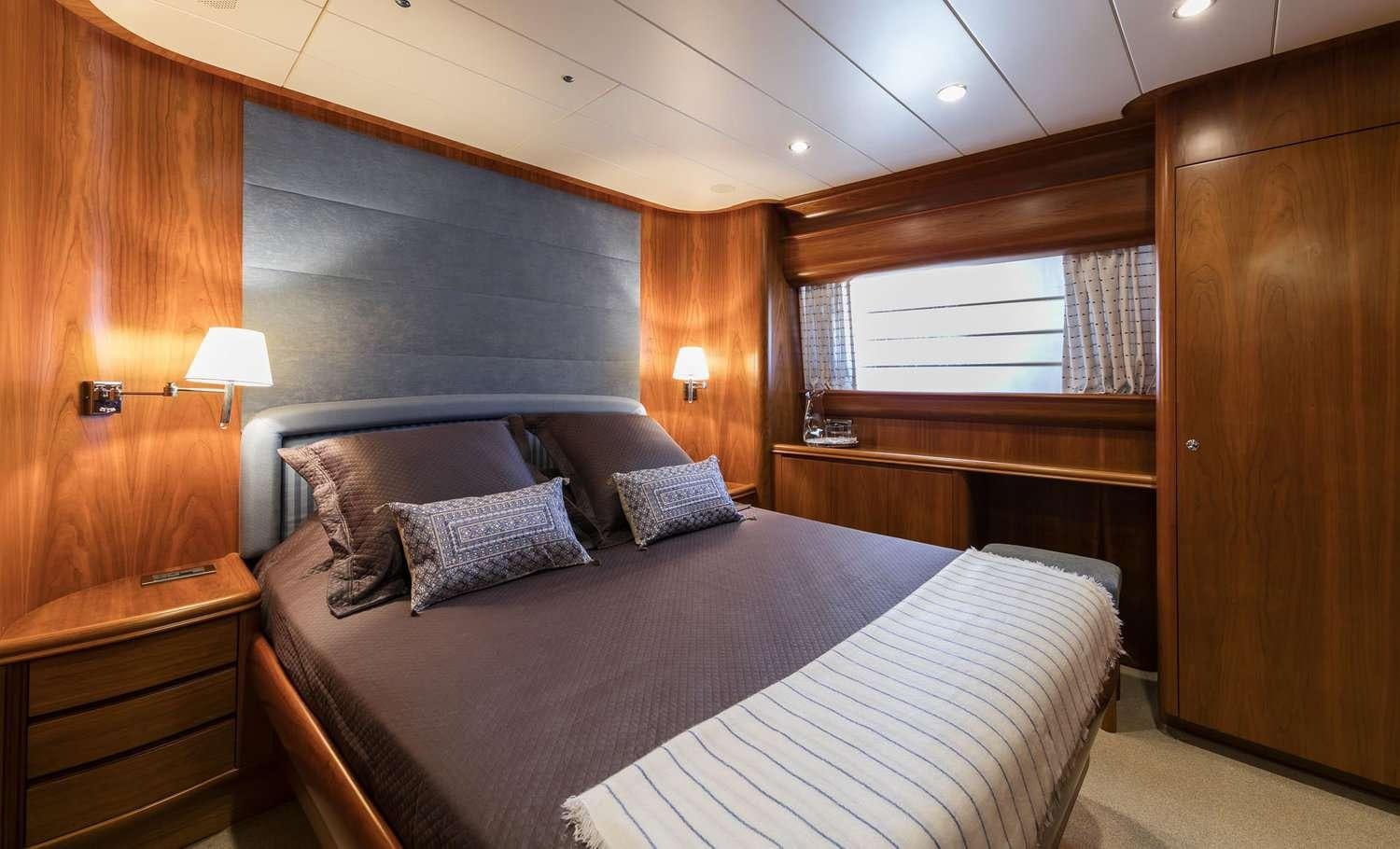 a bed in a room aboard GORGEOUS Yacht for Charter