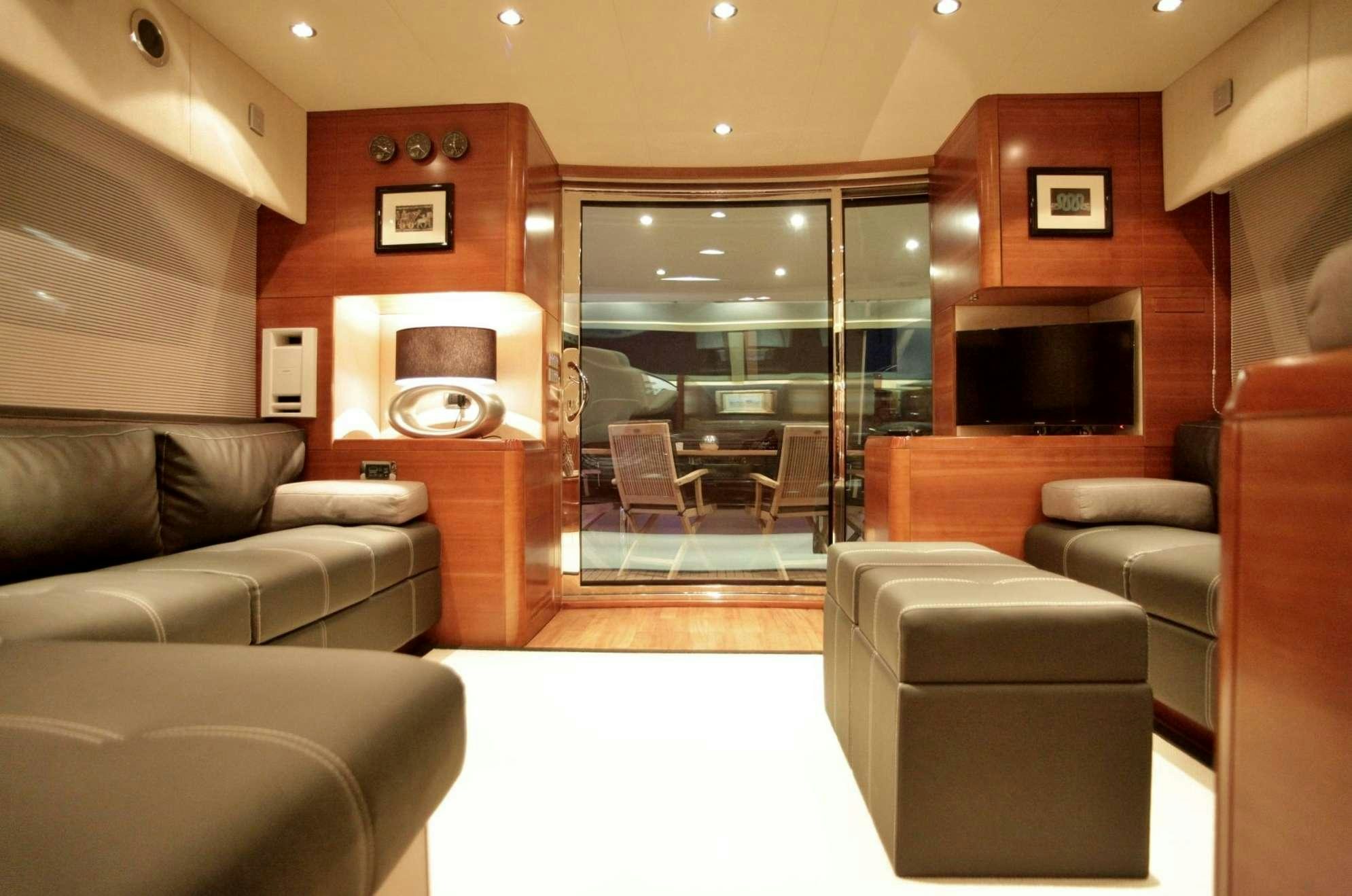 a living room with a fireplace aboard REVIVAL Yacht for Charter