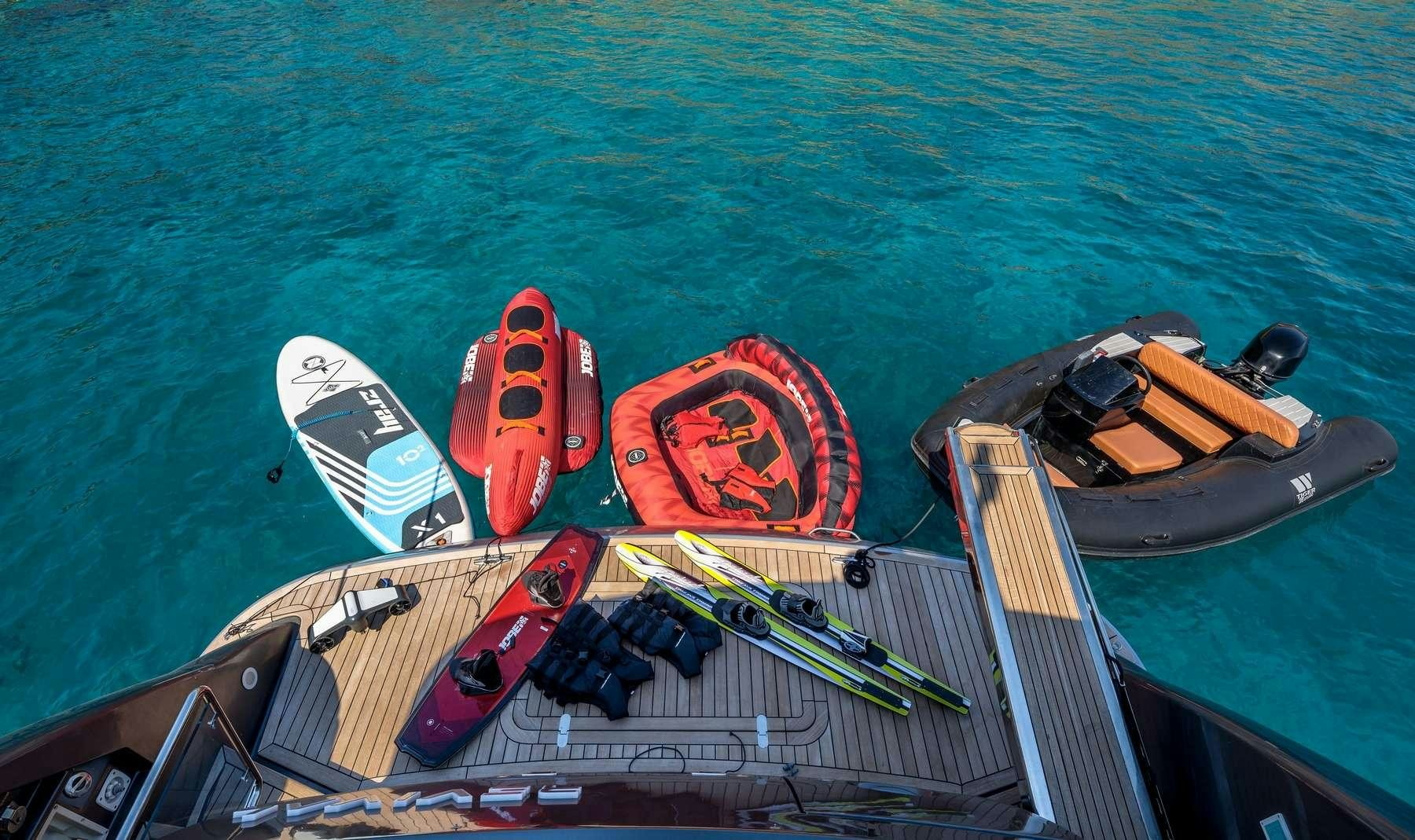 a boat with kayaks on it aboard REVIVAL Yacht for Charter