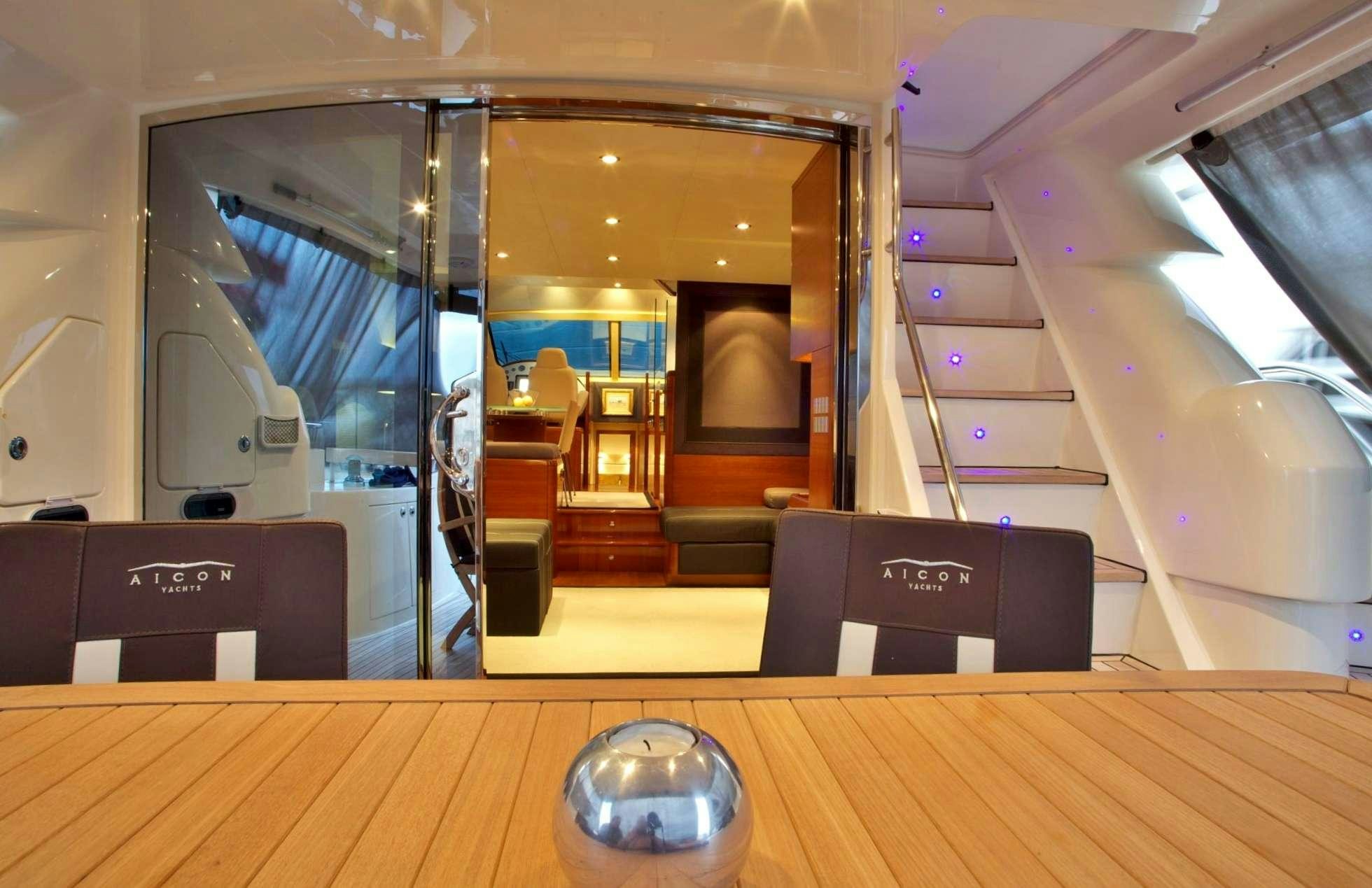 a room with a table and a mirror aboard REVIVAL Yacht for Charter