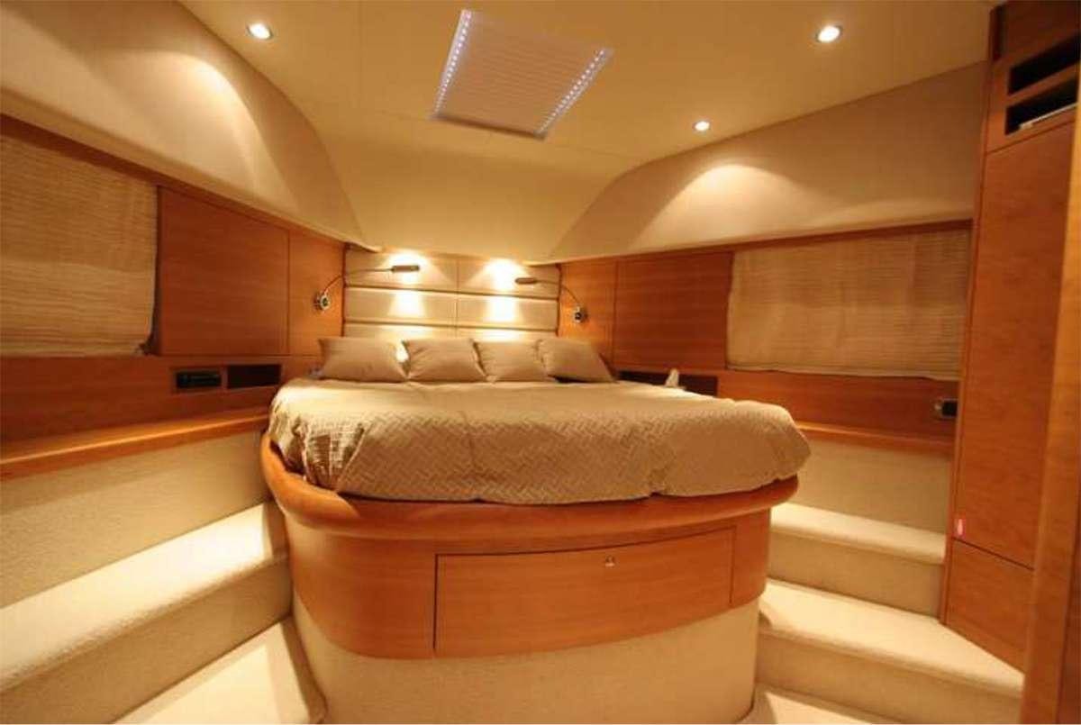a bed in a room aboard REVIVAL Yacht for Charter
